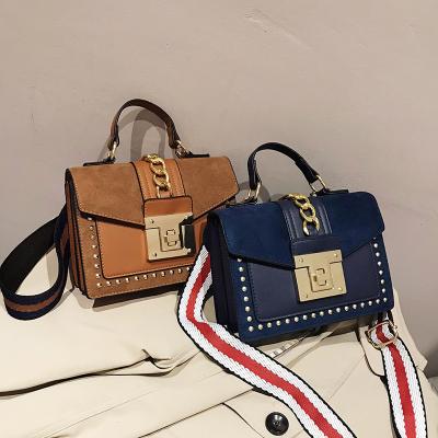 China Latest women\fasion designers bags casual special design chain lock straps leather cross - body handbag with rivet for sale