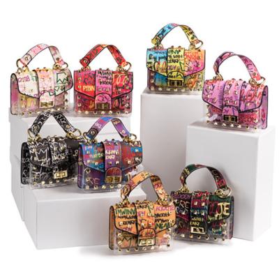 China 2021 Fashion Colorful Jelly Bags Transparent Rivet Graffiti Luxury Chain PU Handbag For Women for sale