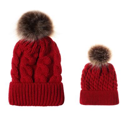 China COMMON Mother and Baby Beanie Hats Winter Beanies Cable Knit Warm Parent-child Faux Raccoon Fur Ball Hats For Winter for sale