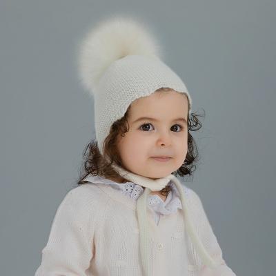 China COMMON Winter Embroidered Kids Children Knitted Hat With Raccoon Fur Pom Custom Logo for sale