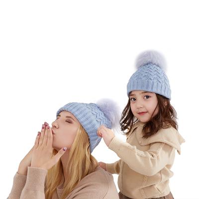 China Soft Blue Custom Mum Hat Beanie Children Hats Caps With Large COMMON Winter Pom Pom for sale