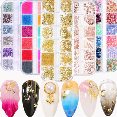 China Easy Apply Wholesale Diamond Rhinestones Different Sizes New Steel Ball Star Moon Ocean Nail Jewelry Rivet Art Long Bar Box Metal Nail for sale