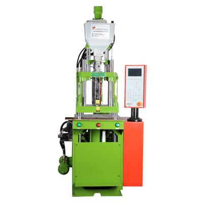 China Simulation of plastic green plant coconut leaf manufacturing equipment vertical injection molding machine zu verkaufen