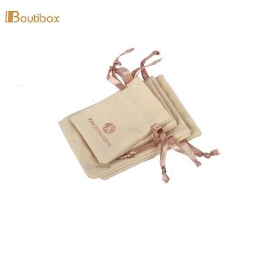 China 2019 Top Grade Beige Gift Packaging Pouch Rose Gold Foil Logo Drawstring Bag With Satin Ribbon for sale