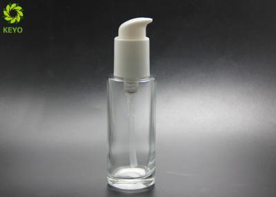 China Luxury Cosmetic Packaging 80ml Round Flat Glass Serum Lotion Bottle With Self Lock Pump for sale