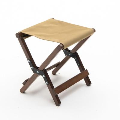 China Easy To Fold And Carry Fashionable Simple Wooden Portable Outdoor Folding Stool for sale