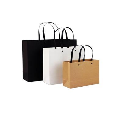 China Recyclable Wholesale Cosmetic Custom Kraft Paper Packaging Bag With Handles for sale