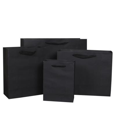 China Recyclable Personality Custom Printed Black Luxury Brand Clothing Retail Packaging Paper Bag for sale