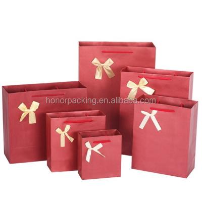 China High quality disposable bow design love boutique paper bag wedding red paper bag for sale for sale