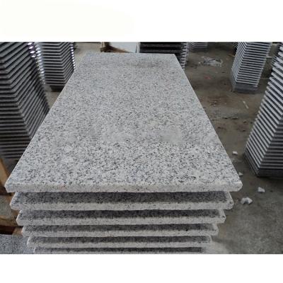 China interior & small surface cheap flamed slab of white granite G603 for paving for sale