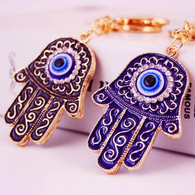 China Eco-friendly Hot Selling Evil Eye Of Fatima Hand Crystal Palm Key Ring Key Chain for sale