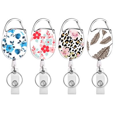 China ABS Badge Creative Retractable Reel Yo-yo With Printing Flowers Leopard Leaves for sale