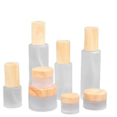 China Personal care wood grain coversuitable for 80ml 100ml glass bottle with box for lotion cream spray cosmetics liquid packaging perfume bottle for sale