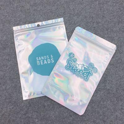 China Hologram Transparent Small Zipper Jewelry Makeup Bag Seal Three Transparent Holographic Jewelry Makeup Zipper Side Resealable Plastic Packaging for sale