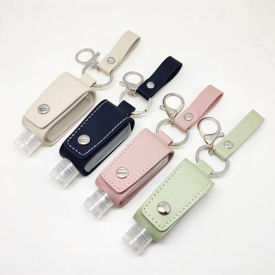 China Custom Cute Black White White Hand Sanitizer Holder Outdoor Portable Leather PU Key Chain Empty Hand Sanitizer for sale