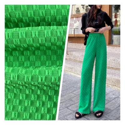 China Stretch Hot sale 90%Polyester 10%Spandex 4 way stretch Plaid bubble green Fabric for trousers for sale