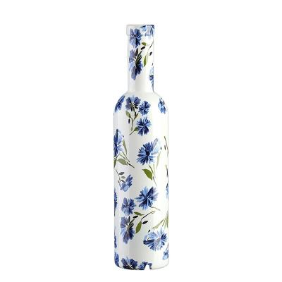 China Beverage customized 700ml flint transparentspirit rum wine vodka oil color glass wine bottle with flower pattern for sale