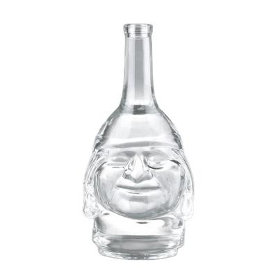 China Custom Beverage Logo Embossed Rum Bottle Glass Whiskey Face Pattern Bottle Spirit Bottle 700ml With Rooster for sale