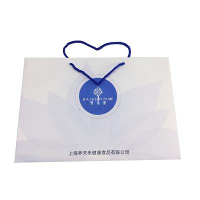 China Custom Materials Fashion Recycled Paper Bag Gift Red Cosmetic Luxury Paper Shopping Bag With Logo Print for sale