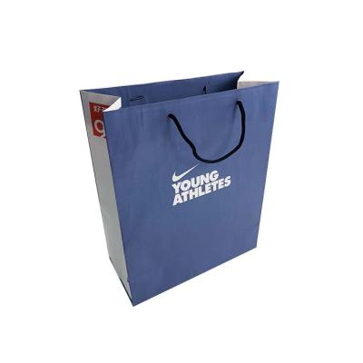 China Recycled Materials Luxury Custom Logo Printed Kraft Paper Packaging Clothing Shoes Bag With Your Own Logo for sale