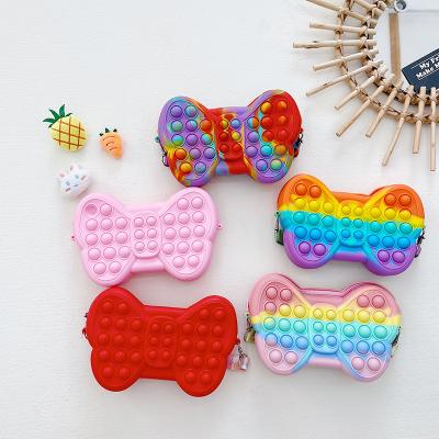 China Reusable Kids Toddler Rainbow Silicone Push Bubble Bow-knot Shape Pop It Wiggle Purse for sale