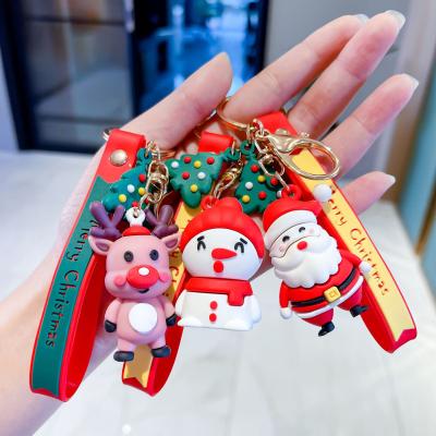 China Christmas red elks snowman fashion kawaii pvc keychain 3d christmas reindeer key chain cartoon santa claus key chain for sale