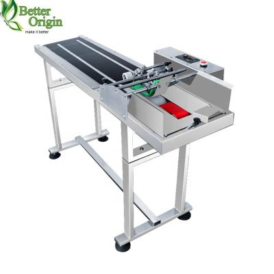 China Automatic food feeder paging machine for plastic bags, paper, card, carton box, labe for sale