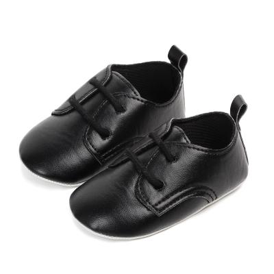 China Hot Selling PU Stylish Black And White Baby Shoes For Baby Girl Boy Leather Shoes for sale