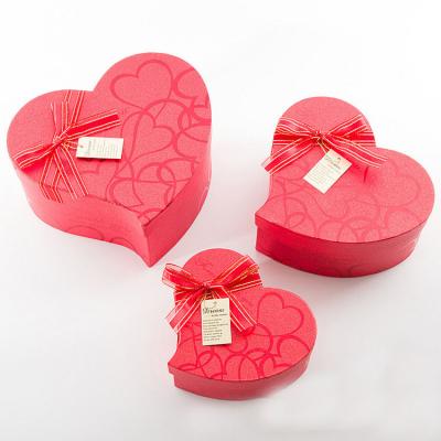 China Recyclable cardboard peach heart three piece gift box with ribbon dessert container valentine heart shaped box for sale