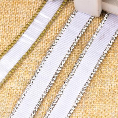 China 1.5cm wide workable rhinestone ribbon strips adhesive tape diamond stickers film fabric barcode dancewear costumes decorative belt for sale