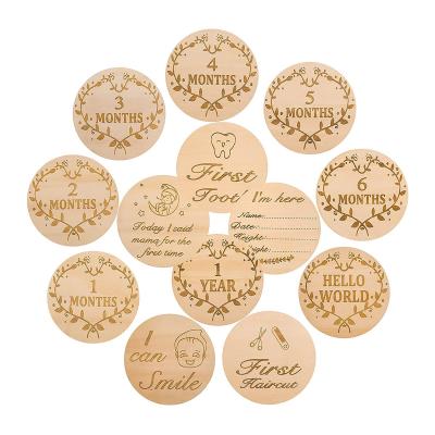 China Natural Material 13PCS Round Wooden Monthly Milestone Markers Double Sided Cutout Baby Photo Props Gift Set for Baby Shower 0-12 Growth Record for sale