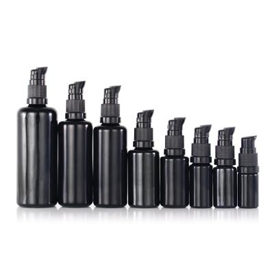 China 5ml 10ml 15ml 30ml 50ml 60ml 100ml 200ml black glass bottle automat cosmetic round shoulder production for cosmetic for sale