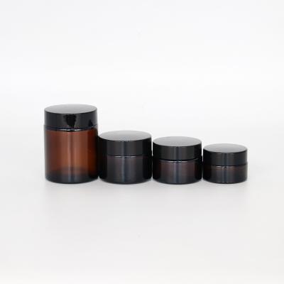 China 20g 30g 50g 100g cosmetic empty amber glass cosmetic jar with metal lid for sale