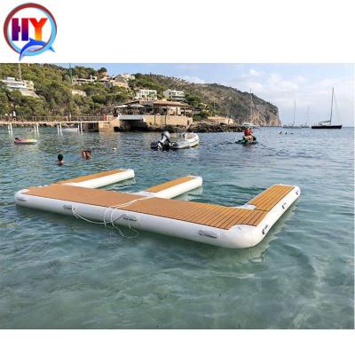 China Drop Point Teak Foam Wood Grain Motorboat Station U Station Etc. Motorboat Shape Inflatable Floating Jet Ski Dock Swimming Pool Platform for sale