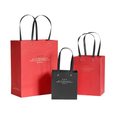 China Recyclable Wholesale Promotional Luxury Clothing Shopping Gift Packaging Paper Bag With Your Own Logo for sale