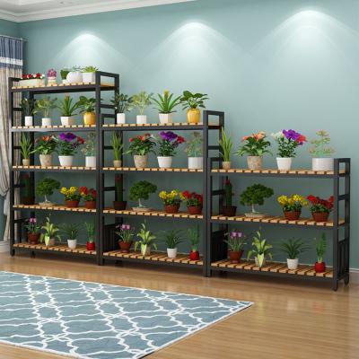 China Modern Multi-Layer Floor Stand Outdoor Balcony Flower Shelf Succulent Partition Rack Solid Wood Wrought Iron Flower Stand for sale