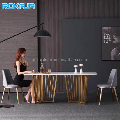 China Factory hot sale adjustable dining table stone dining table luxury marble metal base chipboard top set and chairs combination gold for sale