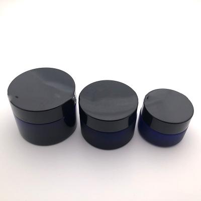 China Promotional custom made cosmetic glass 2oz glass jar black with aluminum/plastic lid for sale