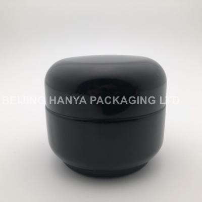 China Cosmetic 1 Ounce 4 Ounce Black Cosmetic Glass Jar 50ml Wholesale for sale