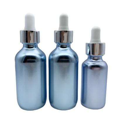 China 30ml Cosmetic Blue Serum Boston Round Glass Dropper Bottle Essential Oil Pink Glass Bottle for sale