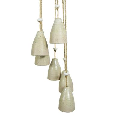 China Craft Ceramic Wrought Wind Chime Europe Porcelain Outdoor Handing Wind Chimes For Home Decoration for sale