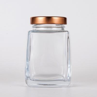 China Viable Factory Direct Sale Mini Glass Jars for Honey with Rose Gold Metal Lid for sale