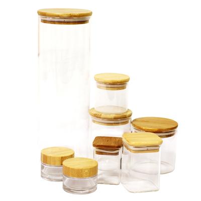 China Heatable Wholesale customization  wholesale glass bottles jars square glass jar 50ml small jars with lids glass for sale