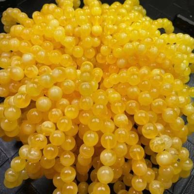 China Natural Amber Stone Bead 10-12mm Yellow Amber Beads Bracelets Baltic Yellow And Russian Amber Loose Amber Beads White for sale