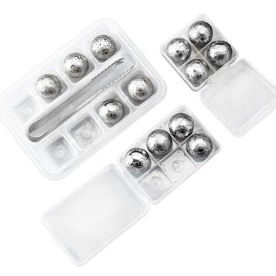 China CLASSIC Reusable 304 Stainless Steel Football Shaped Whiskey Ice Cubes Cooling Stones Ice Cooler for sale