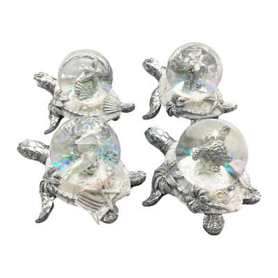 China Seaside Well Sell New Type Silver Turtle Shell Glitter Wedding Glass Water Globe for sale