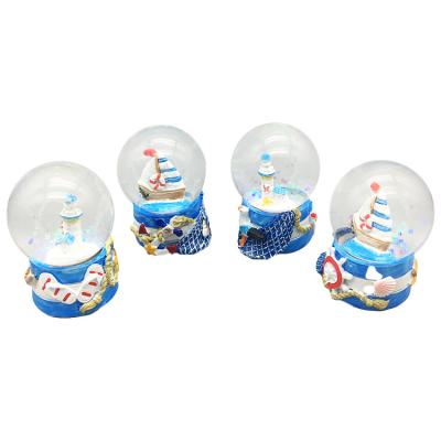 China Factory Wholesale Seaside Lighthouse Resin Snow Globe Crystal Water Ball Directly for sale