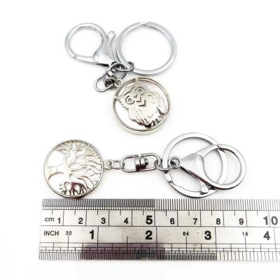 China Metal Selling Well Good Quality Metal Key Chains Round Shell White Fancy Owl Tree Popular Key Rings For Car Hotel Screen Start Key Collection for sale