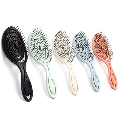 China Paddle Detangle Hair Brush For Curly Hair Brush Vented Around Nylon Biodegradable Curved Hair Brush for sale