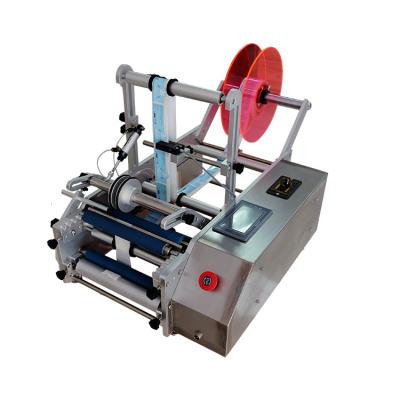 China Manual Cleaner Liquid Cigar Box Plastic Round Bottle Labeling Machine Label Roller Applicator for sale